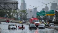 Cars in floodwater on the FDR highway in Manhattan, New York on September 29, 2023. (Photo by Ed Jones/ AFP)