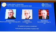 A screen shows this year's laureates US Chemist Moungi Bawendi, US Chemist Louis Brus and Russian physicist Alexei Ekimov during the announcement of the winners of the 2023 Nobel Prize in chemistry on October 4, 2023. (Photo by Jonathan Nackstrand / AFP)