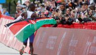 Kenya's Kelvin Kiptum celebrates winning the 2023 Bank of America Chicago Marathon in Chicago, Illinois, in a world record time of two hours and 35 seconds on October 8, 2023. (Photo by KAMIL KRZACZYNSKI / AFP)
