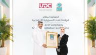 Director of Public Services at UDC, Abdullatif Al Yafei receiving CSR Accreditation from Dr. Hanaa Albanna, CSR Accreditation – MENA Region Representative.