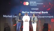 QNB official receives the award at the Mastercard Edge 2023 Forum.