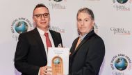 QIB’s Chief Strategy & Digital Officer Constantinos Constantinides (left) receives awards at Global Finance’s 2023 World’s Best Digital Bank Awards ceremony.