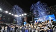 The Texas Rangers are awarded the Commissioner's Trophy after defeating the Arizona Diamondbacks in Game Five to win the World Series at Chase Field on November 01, 2023 in Phoenix, Arizona. Photo by Christian Petersen / GETTY IMAGES NORTH AMERICA / Getty Images via AFP)
