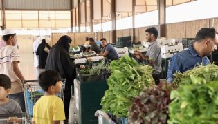 Customers buying vegetables at Al Mazrouah seasonal vegetable market. Pic: Ahmed Barakat/ The Peninsula