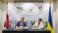 Minister of Communications and Information Technology H E Mohammed bin Ali Al Mannai (left) and Rwanda's Minister of Information Technology, Communications, and Innovation H E Paula Ingabire signing the MoU.