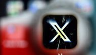 A photo taken on November 17, 2023 shows the logo of US online social media and social networking service X - formerly Twitter - on a smartphone screen in Frankfurt am Main, western Germany. (Photo by Kirill KUDRYAVTSEV / AFP)
