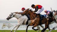 Jockey Kyllan Barbaud and Aajel (left) on their way to win the feature race.