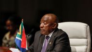(FILES) South African President Cyril Ramaphosa delivers his remarks at the plenary session during the 2023 BRICS Summit at the Sandton Convention Centre in Johannesburg on August 23, 2023. (Photo by GIANLUIGI GUERCIA / POOL / AFP)
