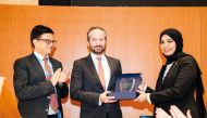 Permanent Representative of Qatar to UN in Geneva H E Dr. Hind bint Abdulrahman Al Muftah (right) handing over 'Best Negotiator of the Year' award to Farid Chrabieh, from the International Committee of the Red Cross. 
