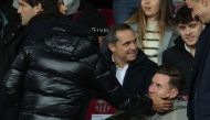 Former player of Barcelona Jordi Alba (L) caresses Barcelona's German goalkeeper #01 Marc-Andre ter Stegen's face during the Spanish league football match between FC Barcelona and Club Atletico de Madrid at the Estadi Olimpic Lluis Companys in Barcelona on December 3, 2023. (Photo by LLUIS GENE / AFP)
