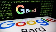 This photograph taken in Toulouse, southwestern France, on July 18, 2023 shows screens displaying the logos of Bard AI, a conversational artificial intelligence software application developed by Google. Photo by Lionel BONAVENTURE / AFP