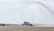 The Qatar Airways flight is welcomed on its arrival in Yanbu yesterday.