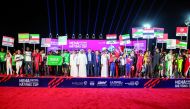 Qatar Motor and Motorcycle Federation (QMMF) and Lusail International Circuit (LIC) President Abdulrahman bin Abdullatif Al Mannai, QMMF’s Executive Director and CEO of LIC Amro Al Hamad and FIA representatives with the participating teams at the opening ceremony of MENA Karting Championship Nations Cup 2023 at the Lusail International Circuit’s karting track yesterday.