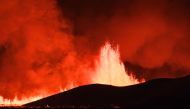 Flowing lava is seen during at a fissure on the Reykjanes peninsula 3km north of Grindavik, western Iceland on December 18, 2023. Photo by Kristinn Magnusson / AFP