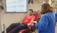 A man donates blood during the campaign.