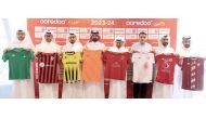 Club representatives hold their team jerseys following a technical meeting held yesterday.