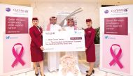 Qatar Airways Group Chief Executive Officer, Engr. Badr Mohammed Al Meer (second left) presenting a donation cheque to Chairman of Qatar Cancer Society, H E Sheikh Dr. Khalid bin Jabr Al Thani (second right).
