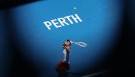 Poland's Iga Swiatek serves against China's Qinwen Zheng during their women's singles match at the United Cup tennis tournament in Perth on January 3, 2024. Photo by COLIN MURTY / AFP