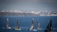 Ultim multihulls take the start of the Arkea Ultim Challenge, a solo round-the-world race on a multihull, off the coast of Brest, on January 7, 2024. (Photo by Loic Venance / AFP)