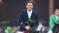 French rider Simon Delestre riding Olga van de Kruishoeve celebrates after his victory. 