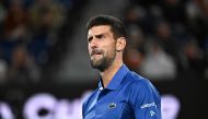 Serbia's Novak Djokovic reacts on a point against Australia's Alexei Popyrin in Melbourne on January 17, 2024. (Photo by Lillian Suwanrumpha / AFP) 
