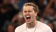 Germany's Alexander Zverev celebrates match point against Slovakia's Lukas Klein during their men's singles match on day five of the Australian Open tennis tournament in Melbourne on January 18, 2024. (Photo by David GRAY / AFP)