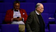 Honorary chairman of Germany's far-right Alternative for Germany (AfD) party Alexander Gauland (R) walks past AfD parliamentary group member Stefan Keuter as they attend a debate at the Bundestag (lower house of parliament) over a meeting of AfD officials with an Austrian extremist leader in November 2023, where mass deportations of immigrants were discussed, on January 18, 2024 at the Bundestag in Berlin. (Photo by JOHN MACDOUGALL / AFP)
