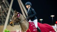 Sweden’s Evelina Tovek celebrates after winning the CSI4* 1.50m event.