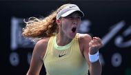 Russia's Mirra Andreeva reacts after a point against France's Diane Parry during their women's singles match on day six of the Australian Open tennis tournament in Melbourne on January 19, 2024. (Photo by Lillian SUWANRUMPHA / AFP) 