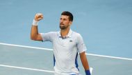 Serbia's Novak Djokovic celebrates after victory against USA's Taylor Fritz during their men's singles quarter-final match on day 10 of the Australian Open tennis tournament in Melbourne on January 23, 2024. (Photo by David Gray / AFP) 