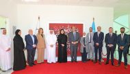 NHRC Chairperson H E Maryam bint Abdullah Al Attiyah with other officials during the inauguration of the painting of Litaarafu at the UN House in Doha.