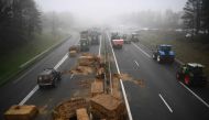 Farmers of the CR47 (Coordination rurale) union block the A62 motor way near Agen, southwerstern France, on January 25, 2024, as part of a nation-wide day of actions and road blockades called by several farming union to protest against increases in production costs and environmental regulations. Photo by Christophe ARCHAMBAULT / AFP