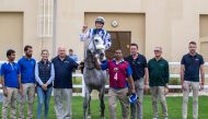 The connections of Dawi celebrate after the win. 