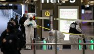 French forensic and judicial police collect evidences after a knife attack at Paris's Gare de Lyon railway station, a major travel hub on February 3, 2024. (Photo by Thomas Samson / AFP)
