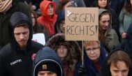 Demonstrators protest against the far-right Alternative for Germany (AfD) party outside the Reichstag building in Berlin, Germany on February 3, 2024, during a rally under the motto 'We are the firewall' called for by international non-profit organisation 'Hand in Hand' to protest against right-wing politics. (Photo by Adam BERRY / AFP)
