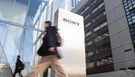 People walk into the headquarters of the Sony Group Corporation in Tokyo on February 14, 2024. Photo by Richard A. Brooks / AFP