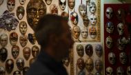 Edmond Angoni, the owner and leading artist behind the Venice Art Mask Factory, gives an interview in his workshop in Shkoder, on February 7, 2024, as more than two dozen craftsmen in a quaint studio in northern Albania put the final touches on a series of elegant Venetian masks destined for balls, film sets, and street parties. Photo by Adnan Beci / AFP