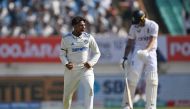 India's Kuldeep Yadav celebrates after the dismissal of England's Ben Duckett during the third day of the third Test cricket match between India and England at the Niranjan Shah Stadium in Rajkot on February 17, 2024. (Photo by Punit Paranjpe / AFP)