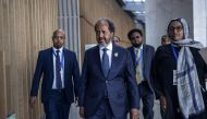 President of Somalia Hassan Sheikh Mohamud (C) makes his way to conduct a press conference following the 37th Ordinary Session of the Assembly of the African Union (AU) at the AU headquarters in Addis Ababa on February 17, 2024. (Photo by Michele Spatari / AFP)
