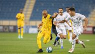 Action during the match between Al Ahli and Al Gharafa yesterday. PIC: QNA  