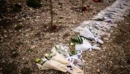 Bunches of flowers are displayed at the crash site in the Valley of Tempi, north of the central city of Larissa on February 28, 2024, during a memorial ceremony as the country marks a year since the 