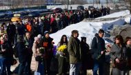 Mourners queue to visit the grave of Russian opposition leader Alexei Navalny at the Borisovo cemetery in Moscow on March 3, 2024. (Photo by Olga Maltseva / AFP)

