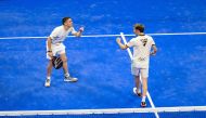 Argentina's Franco Stupaczuk (right) and Martin Di Nenno celebrate after scoring a point against Momo Gonzalez and Federico Chingotto.
