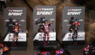 FROM LEFT: Red Bull KTM Factory Racing's South African rider Brad Binder, Prima Pramac Racing's Spanish rider Jorge Martin, and Aprilia Racing's Spanish rider Aleix Espargaro celebrate on the podium after the Qatar Grand Prix MotoGP Sprint at Lusail International Circuit, yesterday. 