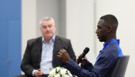Almoez Ali (right) speaks during the launch.