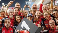 Francesco Bagnaia (centre) celebrates with team members after winning the Qatar MotoGP at the Lusail International Circuit, yesterday. 