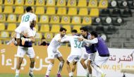 Al Ahli players celebrate after Yazan Al Naimat scored their second goal against Qatar SC, yesterday.