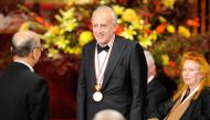Italian pianist Maurizio Pollini receives a medal at the awards ceremony of the 22nd Praemium Imperiale Awards in Tokyo on October 13, 2010. (Photo by TORU YAMANAKA / AFP)