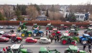 Aerial view shows tractors and vehicles standing along the highway as Polish farmers take part in a blockade in a suburb of Warsaw, Poland, on March 20, 2024. Photo by Wojtek Radwanski / AFP
