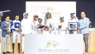 The connections of Tajamhor celebrate after  the Al Dibal Cup triumph. PICS: Juhaim/QREC